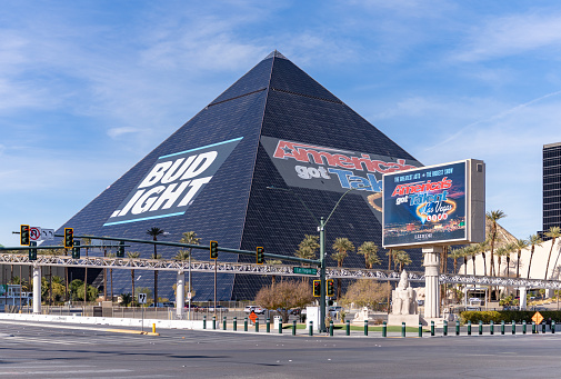 Las Vegas, United States - November 23, 2022: A picture of the Luxor Hotel and Casino pyramid with ads from Bud Light and America's Got Talent.