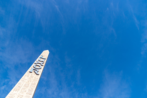 Las Vegas, United States - November 23, 2022: A picture of the obelisk of the Luxor Hotel and Casino against a blue sky.