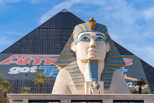 Las Vegas, United States - November 23, 2022: A picture of the Luxor Hotel and Casino pyramid with an ad from America's Got Talent and the sphinx statue.