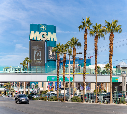 Las Vegas, United States - November 23, 2022: A picture of the MGM Grand billboard and the nearby palm trees.