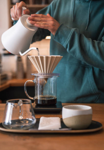 istock Barista making pour-over coffee in coffee shop 1482859961