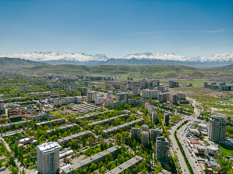 Aerial view of Bishkek city Kyrgyzstan with snow-capped mountains