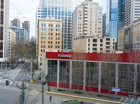 Seattle, United States of America - February 1, 2023: As the Link Light Rail traverses the bustling streets of downtown Seattle, passengers are treated to a breathtaking view of the city from above. With its sleek design and panoramic windows, the rail offers a bird's eye view of the Emerald City's stunning skyline, complete with towering skyscrapers and iconic landmarks such as the Space Needle and the Puget Sound. Whether commuting to work or exploring the city's vibrant neighborhoods, the Link Light Rail provides an unforgettable experience that captures the essence of Seattle's urban charm.