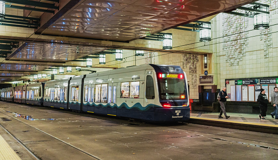 Seattle, United States of America - February 1, 2023: The Link Light Rail is a popular mode of transportation in Seattle that offers efficient and eco-friendly travel options for commuters and visitors. The light rail system runs through a network of tunnels and elevated tracks, connecting downtown Seattle with its surrounding neighborhoods and suburbs. The trains run frequently, offering a reliable and convenient way to get around the city. Plus, with its emphasis on sustainability, the Link Light Rail is a great choice for travelers looking to explore Seattle while minimizing their impact on the environment.