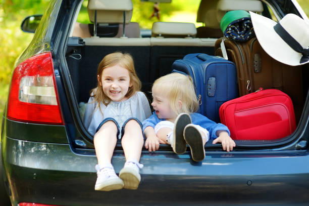 istock Two little sisters going to a car vacation 1482860450