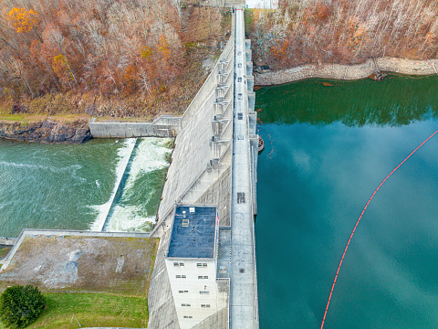 Aerial view of the Sutton Damn.  It is a concrete-gravity structure 210 feet high, 1,178 feet long, and 195 feet wide at the base. It controls a 537 square mile drainage area, including the upper Elk River, and the Holly River. The lake is 125 feet deep at the dam. Sutton Dam is located just above the Town of Sutton