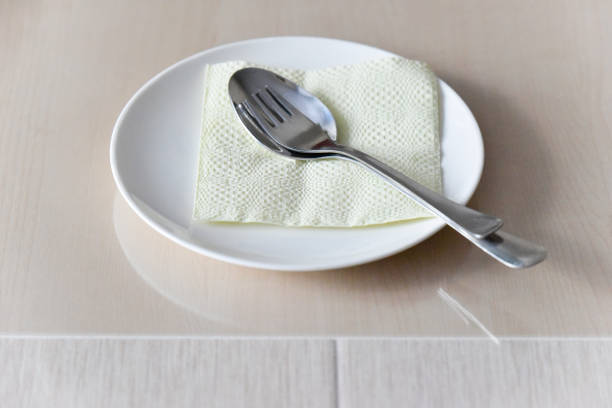 istock white plate served on the wooden table, selective focus 1482863015