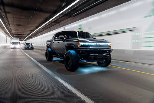 Seattle, WA, USA
April 17, 2023
Hummer EV in black driving in a tunnel