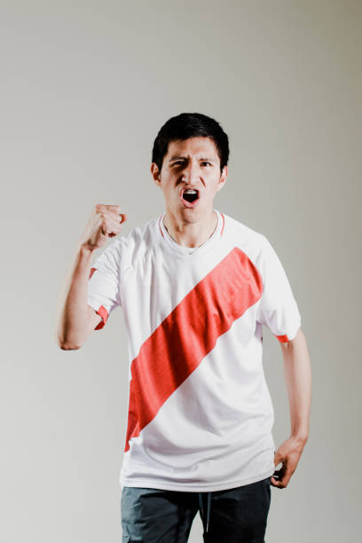 istock Peruvian fan celebrating a goal 1482867317