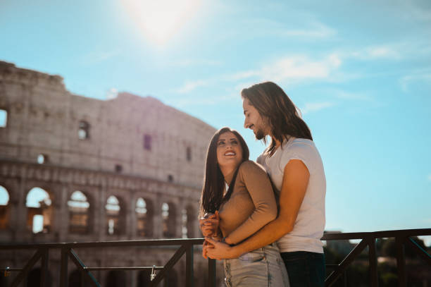 istock Cheerful couple hugging in front of Colosseum 1482867729
