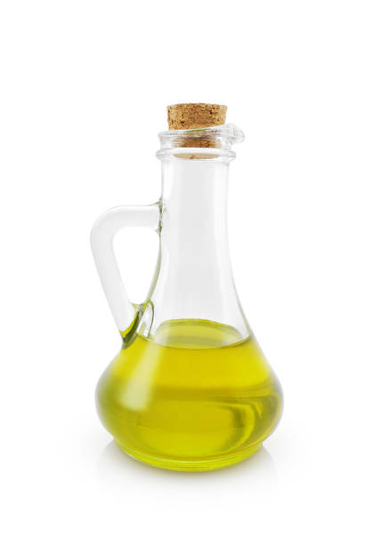 istock Olive oil glass jug isolated on white 1482870780