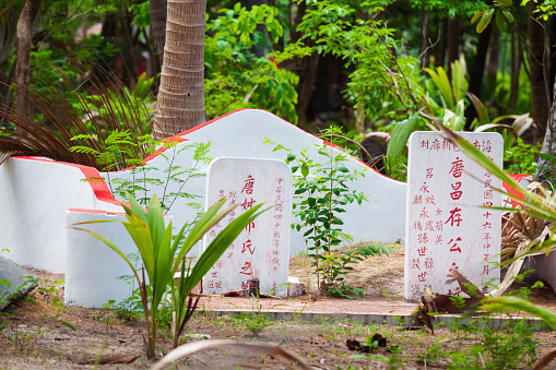 Tombstones on old  cemetery on Ko Samui  in rainforest in south of island in outskirts of Nathon