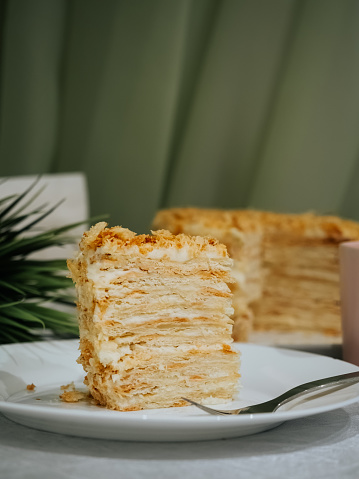 A piece of homemade cake Napoleon close up. Homemade pastry