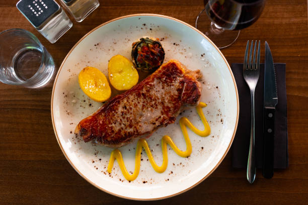 istock Fried piece of beef with potato and vegetables 1482877143