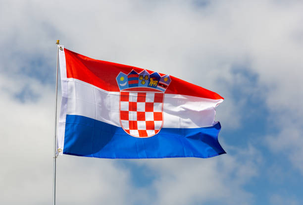 istock Flag of Croatia flying against blue sky 1482877239
