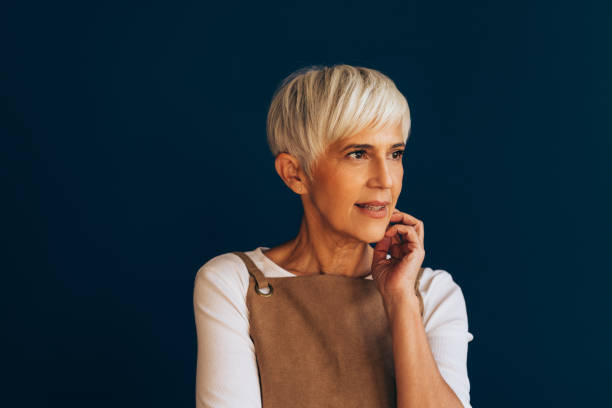 istock A Happy Beautiful Woman With An Apron Looking Away While Contemplating 1482877338