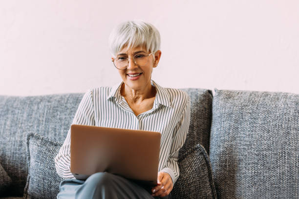 istock A Happy Beautiful Businesswoman Holding Her Notes While Learning Something Online Using Her Computer (E-learning Concept) 1482877375