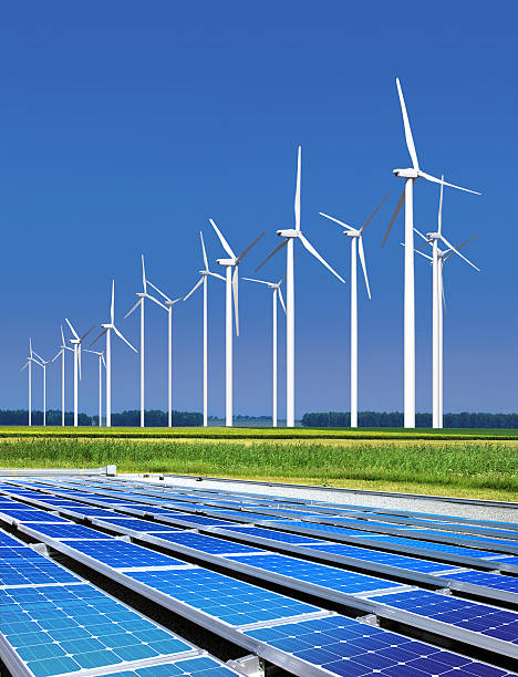 istock Wind turbines and solar panels shot outside with blue sky 148287767