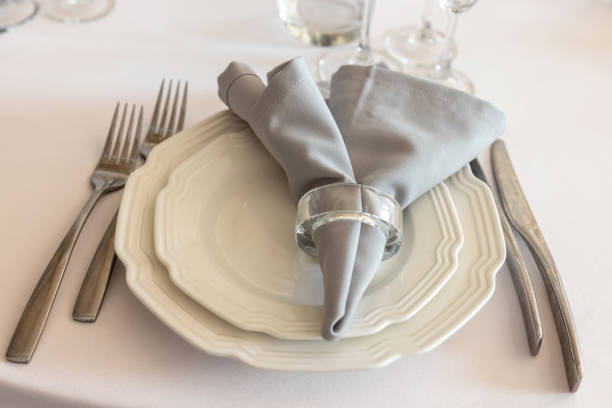 istock table setting. Interior of space is loft-style with tables 1482879265