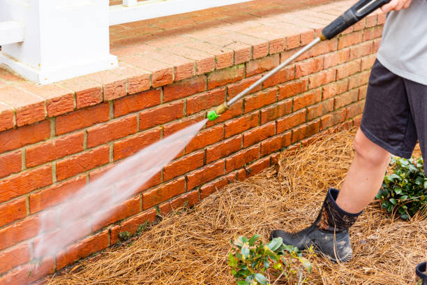 istock Brick surface being cleaned with water from a pressure washer. 1482880573