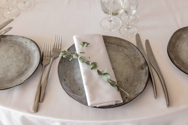istock table setting. Interior of space is loft-style with tables 1482880583