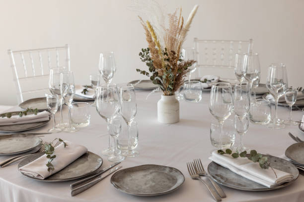 istock table setting. Interior of space is loft-style with tables 1482880640