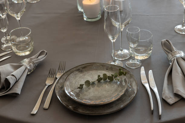 istock table setting. Interior of space is loft-style with tables 1482882959