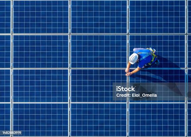 Solar Panel Installer Installing Solar Panels With A Big Copy Space Stock Photo - Download Image Now