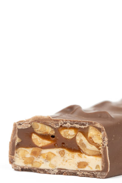 istock Chocolate bar with peanuts isolated above white background 1482883922