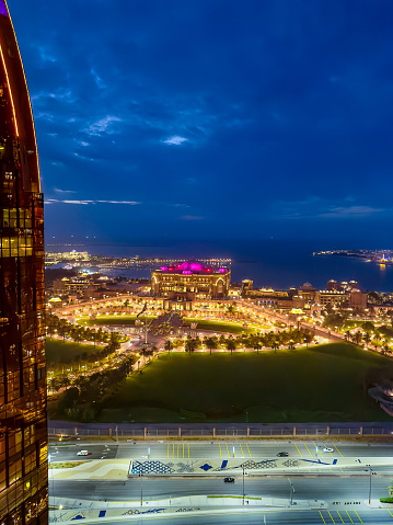 Abu Dhabi, United Arab Emirates - May 22, 2021: Emirates palace mandarin oriental hotel and tourist attraction as a part of Modern skyline of Abu Dhabi downtown cityscape view in the United Arab Emirates at night