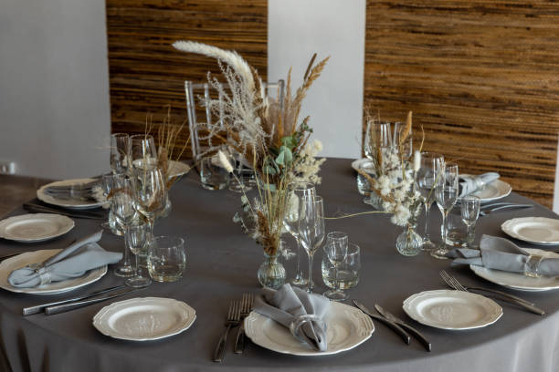 istock table setting. Interior of space is loft-style with tables 1482885106