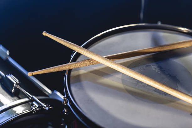 istock Close-up, snare drum and drumsticks on a dark background. 1482886197