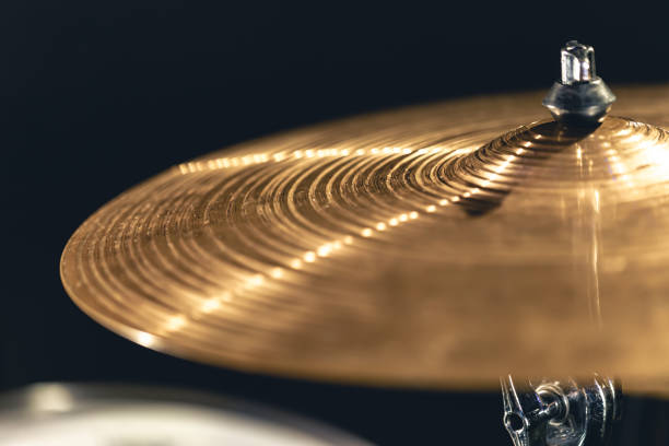 istock Drum cymbal close-up on a dark background. 1482886216