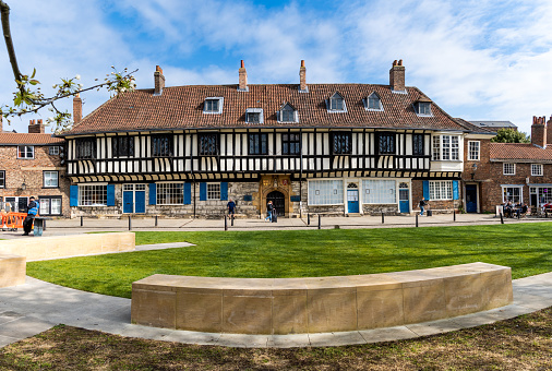 St William's College, York, UK - April 17, 2023. The exterior of St William's College building and park next to York Minster which is a popular tourist destination