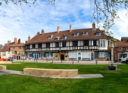 St William's College, York, UK - April 17, 2023. The exterior of St William's College building and park next to York Minster which is a popular tourist destination