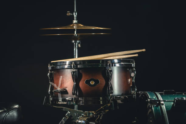 istock Drums on a black background close-up, percussion instrument on stage. 1482886499