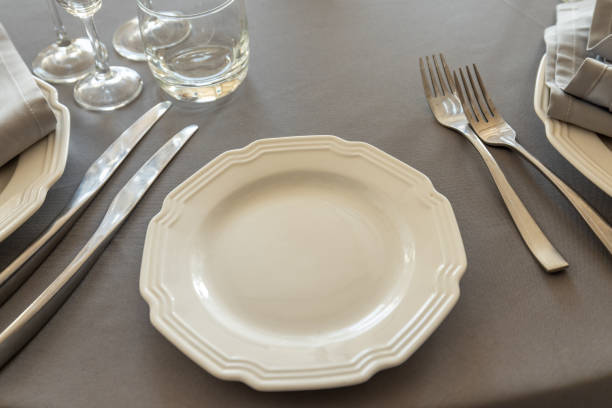 istock table setting. Interior of space is loft-style with tables 1482887336