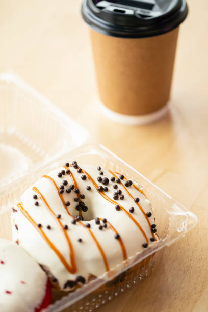 istock Beautiful appetizing donut and a cup of coffee, close-up. 1482887358