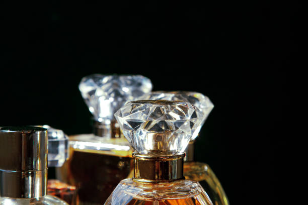 istock Set of perfume bottles on black background. 1482887522