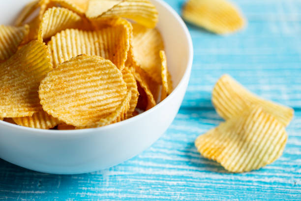 istock Close-up, a plate of potato chips on a blurred background. 1482887568
