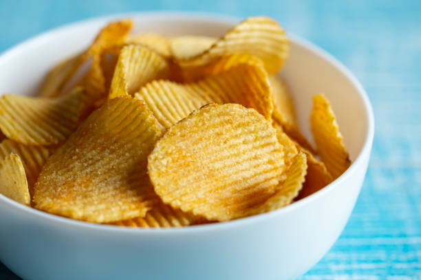 istock Close-up, a plate of potato chips on a blurred background. 1482887572