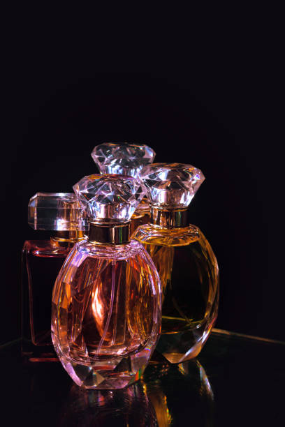 istock Set of perfume bottles on black background. 1482887577