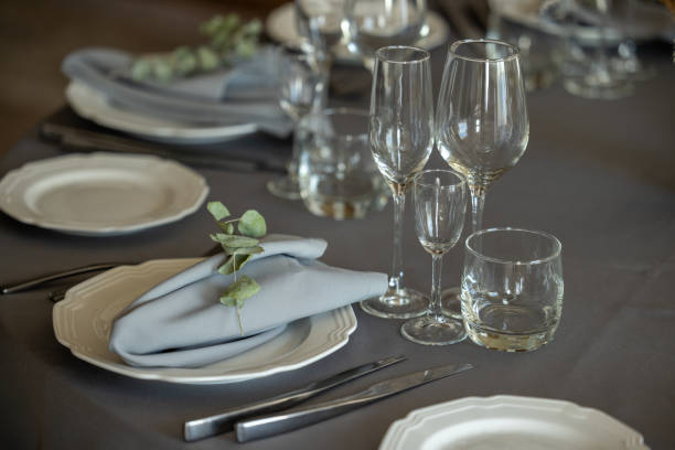 istock table setting. Interior of space is loft-style with tables 1482887639