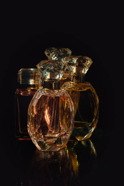 istock Set of perfume bottles on black background. 1482887757