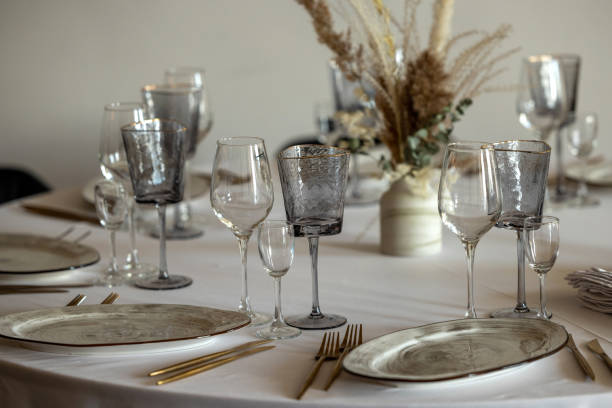 istock table setting. Interior of space is loft-style with tables 1482887801