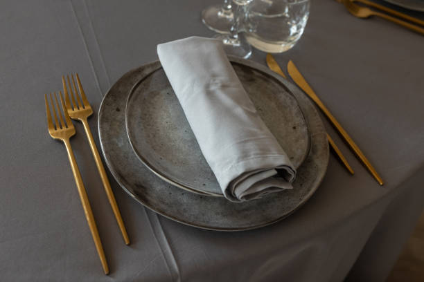 istock table setting. Interior of space is loft-style with tables 1482887843