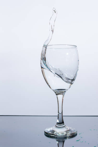 istock Water splashes in a glass on a white background 1482888748