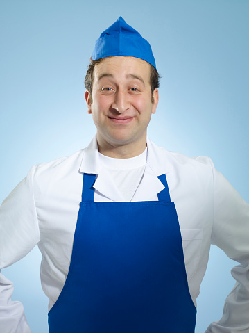 Portrait of a young baker in uniform
