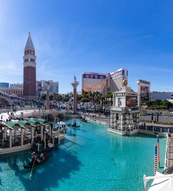 Las Vegas, United States - November 24, 2022: A picture of the Venetian Las Vegas, with the Campanile Tower on the left, the Mirage on the right, and the pond on the bottom.
