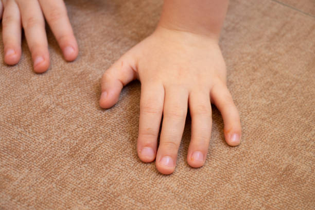 istock children's small palm close-up on a brown tile top view 1482890536
